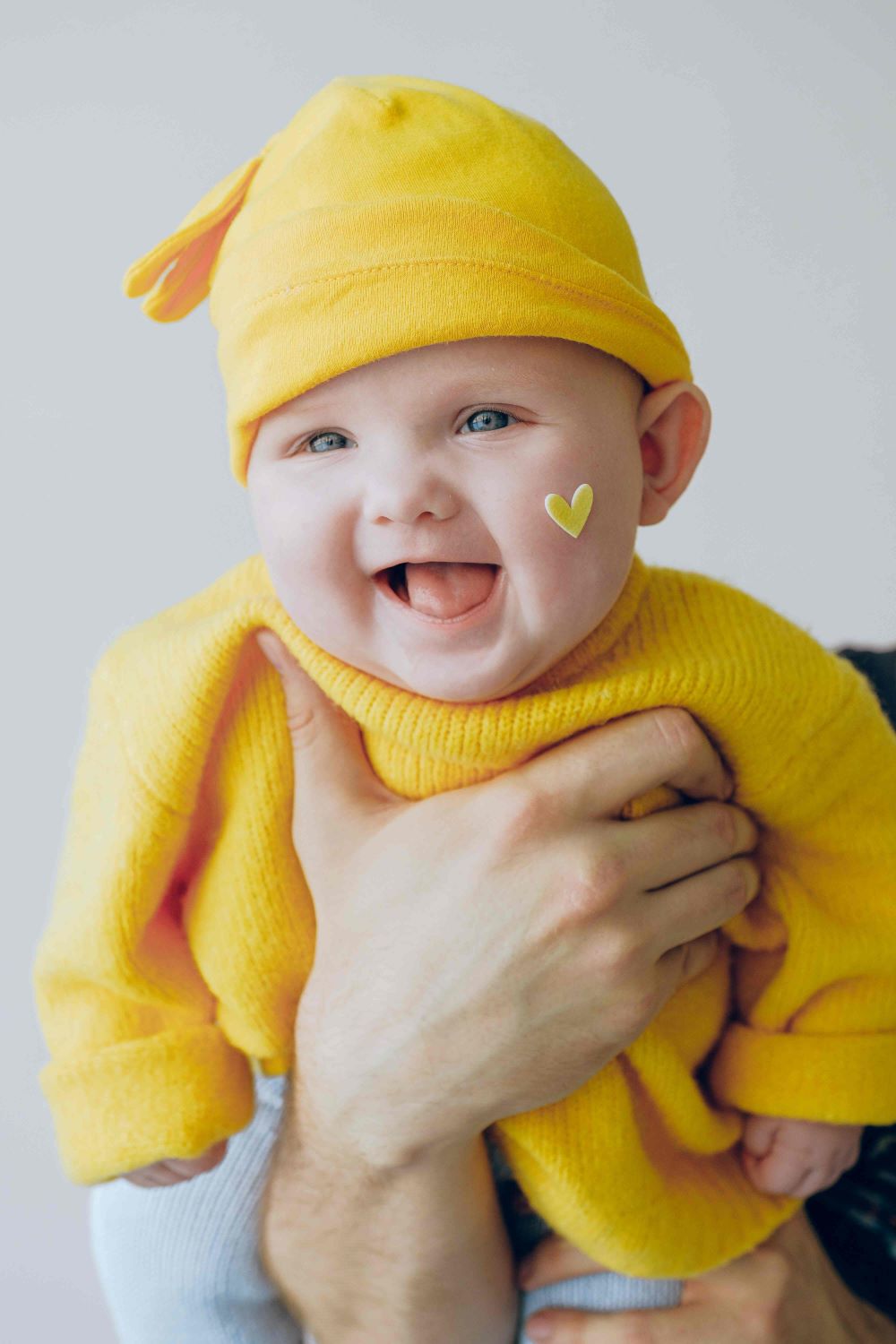 Happy Cranio - Information - Baby mit gelbem Gewand